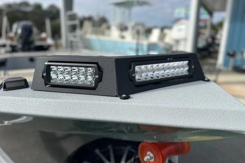 Slide: The Image of Close-up of LED lights on a 2026 Avid 18 Commander boat. - 9