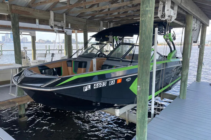 Slide: The Image of 2016 Nautique Super Air Nautique G23 Coastal Edition boat docked in marina. - 3