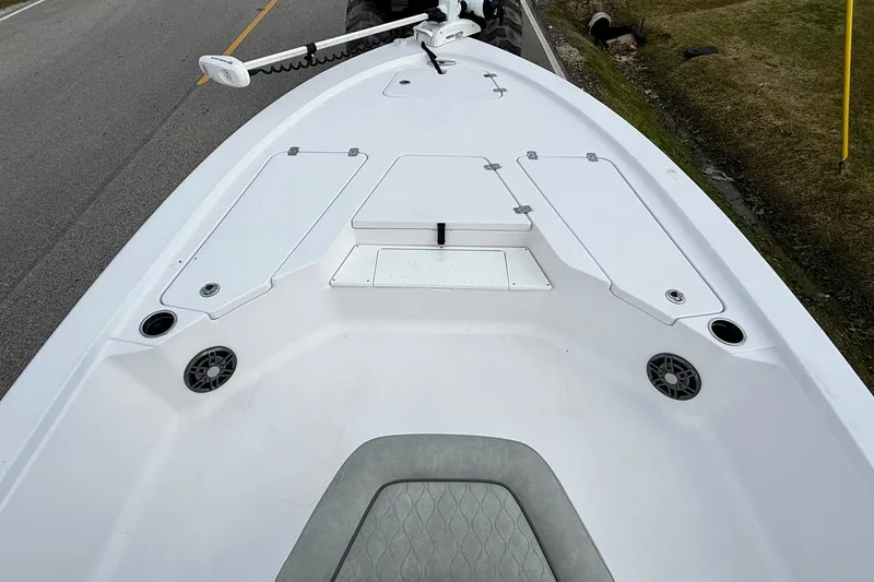 Slide: The Image of 2020 Sportsman Tournament 214 SBX Bay Boat deck with storage compartments and speakers. - 13