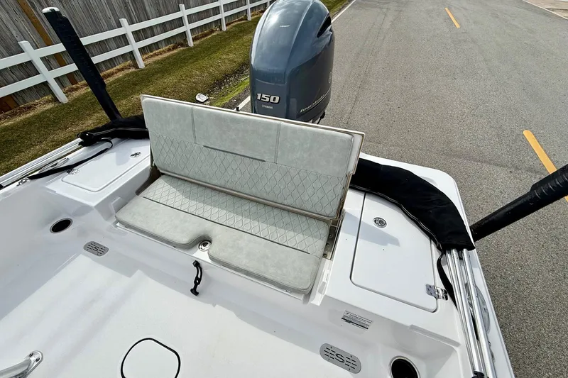 Slide: The Image of 2020 Sportsman Tournament 214 SBX Bay Boat with Yamaha 150 engine, featuring foldable seating. - 7