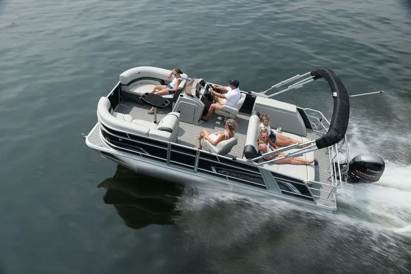 Slide: The Image of Sylvan Mirage 822 CLZ 2026 pontoon boat cruising on water. - 2