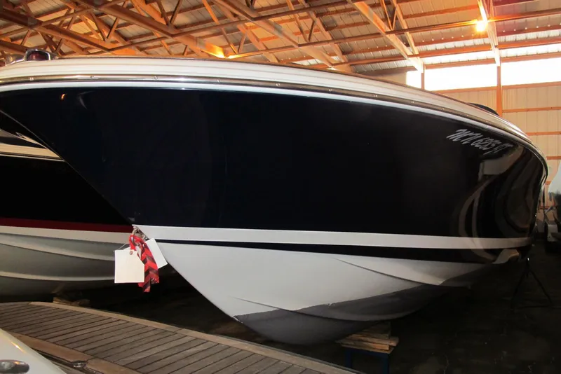 Slide: The Image of 2003 Chris-Craft Corsair 25 Heritage Edition boat in indoor storage facility. - 2