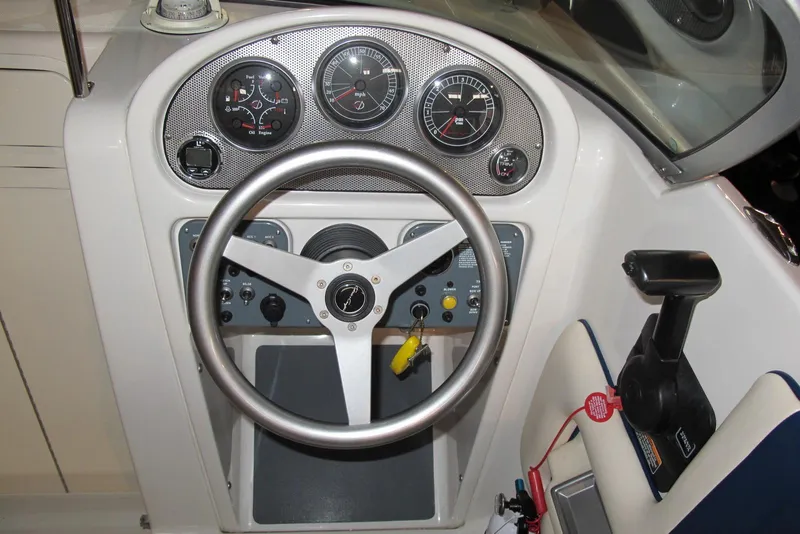 Slide: The Image of 2003 Chris-Craft Corsair 25 Heritage Edition dashboard with steering wheel and controls. - 7