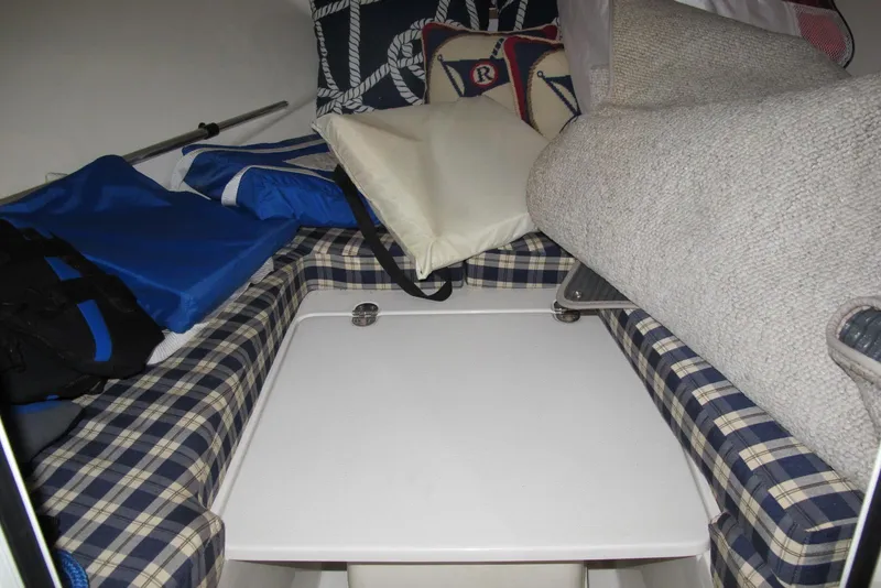Slide: The Image of Interior cabin of 2003 Chris-Craft Corsair 25 Heritage Edition with plaid seating and nautical decor. - 8