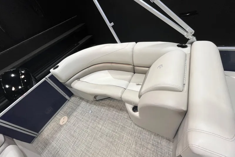 Slide: The Image of 2023 Cypress Cay Seabreeze 232 boat interior with plush seating and modern design. - 11