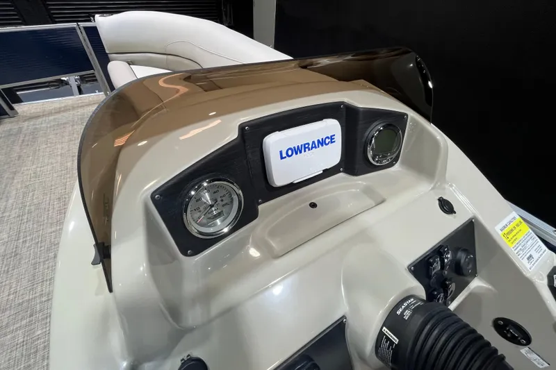 Slide: The Image of 2023 Cypress Cay Seabreeze 232 dashboard with Lowrance display and gauges. - 13