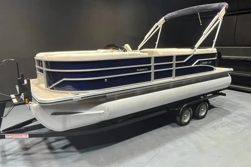 Slide: The Image of 2023 Cypress Cay Seabreeze 232 pontoon boat on trailer in showroom. - 3