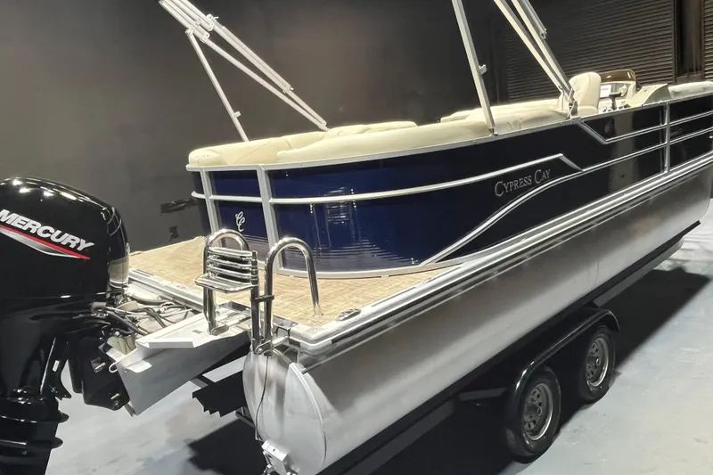 Slide: The Image of 2023 Cypress Cay Seabreeze 232 pontoon boat with Mercury engine on trailer. - 5