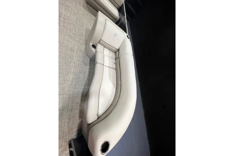 Slide: The Image of 2023 Cypress Cay Seabreeze 232 boat interior with elegant beige seating. - 7