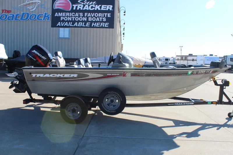 The Image of 2004 Tracker Pro Angler V 16 boat on trailer, displayed outdoors. - 0