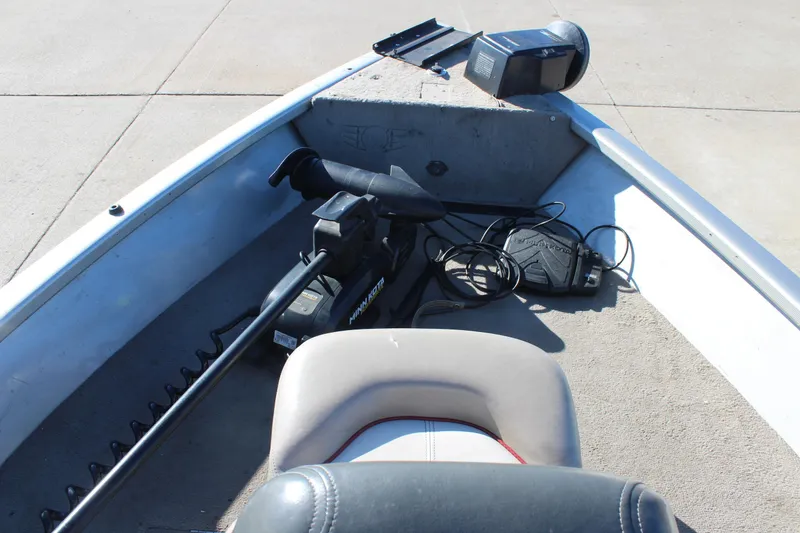 Slide: The Image of 2004 Tracker Pro Angler V 16 boat interior with trolling motor and seat. - 12