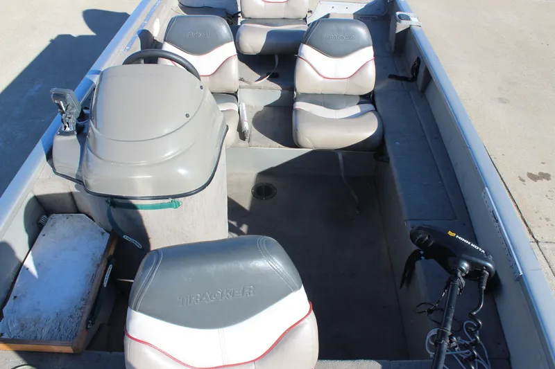 Slide: The Image of 2004 Tracker Pro Angler V 16 boat interior with seating and steering console. - 13