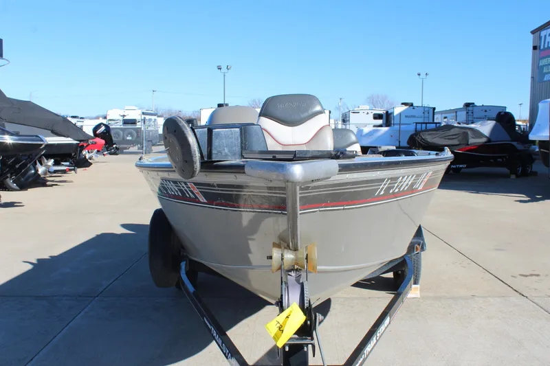 Slide: The Image of 2004 Tracker Pro Angler V 16 boat on trailer in outdoor lot. - 2