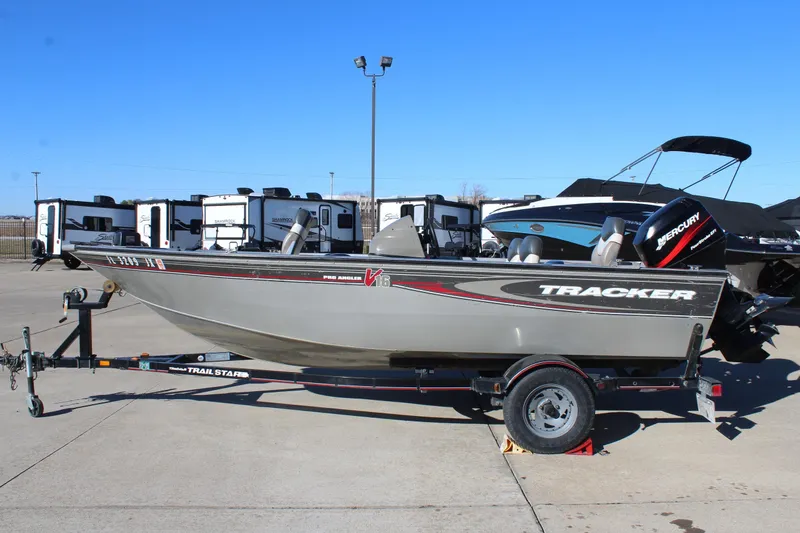 Slide: The Image of 2004 Tracker Pro Angler V 16 boat on trailer in outdoor lot. - 4
