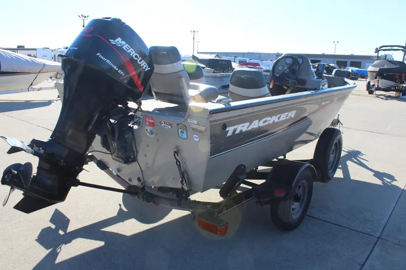 Slide: The Image of 2004 Tracker Pro Angler V 16 boat with Mercury outboard motor on trailer. - 7