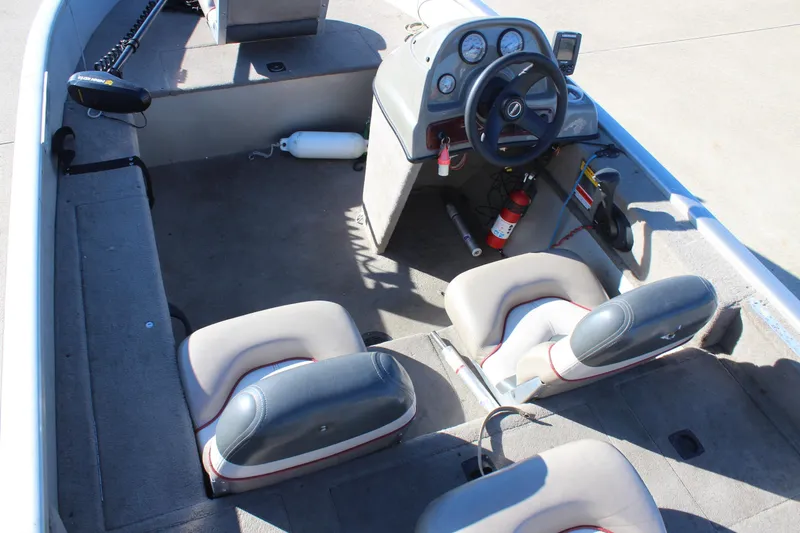 Slide: The Image of 2004 Tracker Pro Angler V 16 boat interior with steering console and seating. - 8
