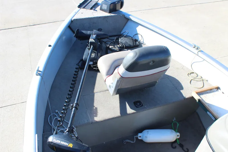 Slide: The Image of 2004 Tracker Pro Angler V 16 boat interior with seat and trolling motor. - 9
