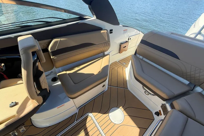 Slide: The Image of Interior of 2026 Sea Ray SLX 260 Outboard with luxurious seating. - 19