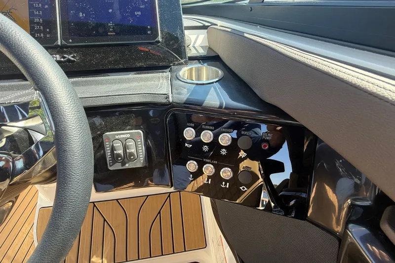 Slide: The Image of Dashboard of 2026 Sea Ray SLX 260 Outboard with controls. - 23