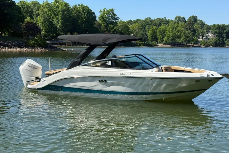 Slide: The Image of 2026 Sea Ray SLX 260 Outboard on a tranquil lake. - 4