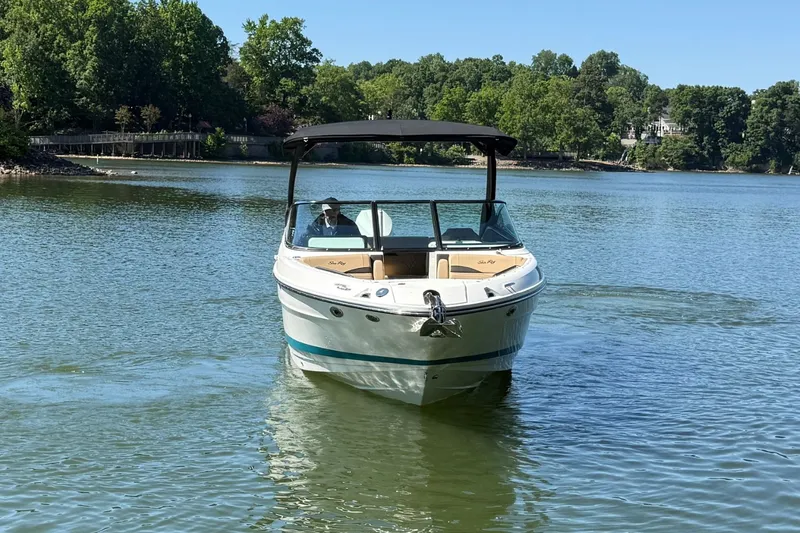 Slide: The Image of 2026 Sea Ray SLX 260 Outboard on a tranquil lake. - 6