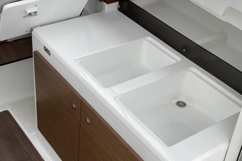 Slide: The Image of Kitchen area of Jeanneau NC Weekender 695 Series 2, 2022. - 2