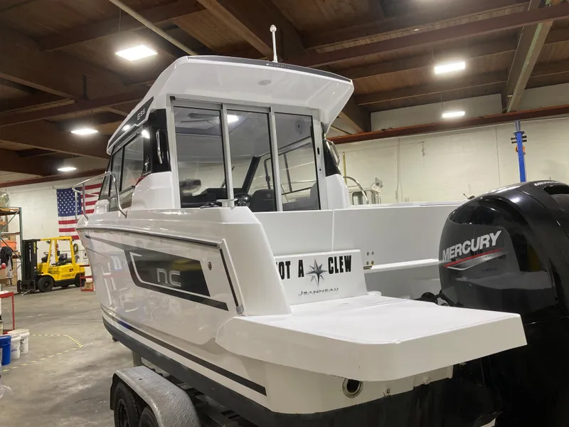 Slide: The Image of 2022 Jeanneau NC Weekender 695 Series 2 boat in a workshop. - 5