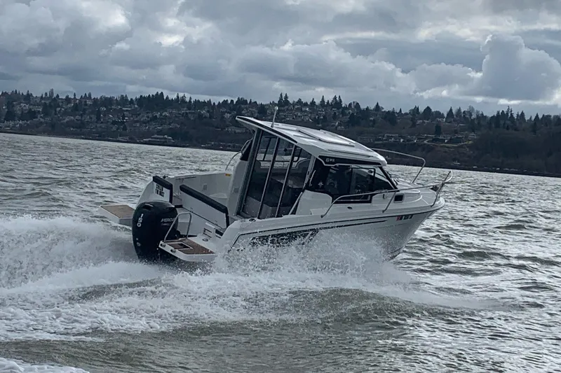 Slide: The Image of 2022 Jeanneau NC Weekender 695 Series 2 on choppy waters. - 9