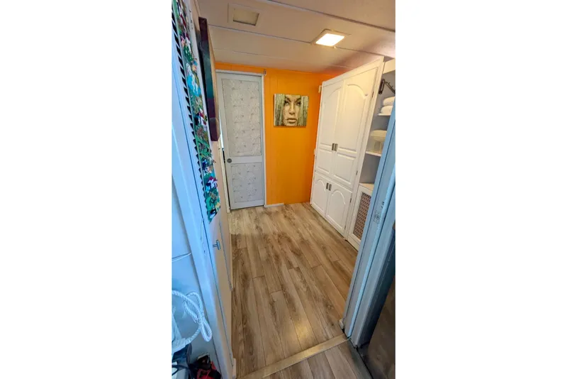 Slide: The Image of Cozy interior of a 1986 Stardust Cruisers 52 houseboat with vibrant decor and comfortable seating. - 10