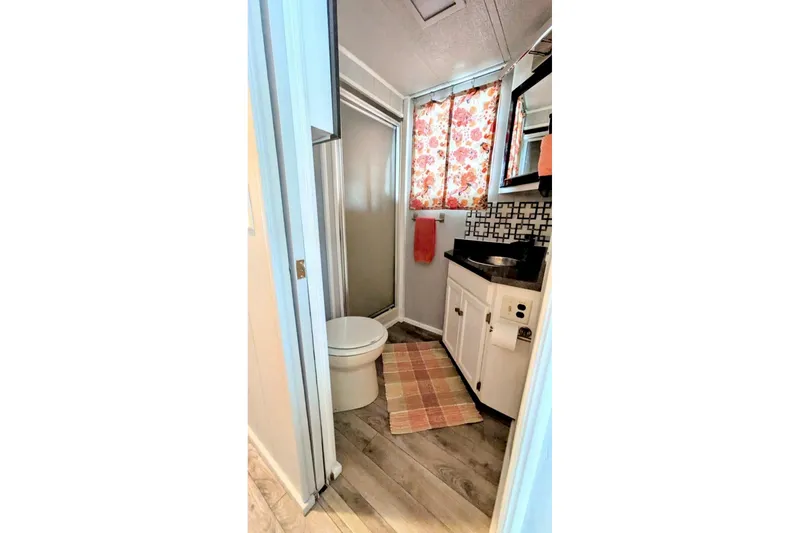 Slide: The Image of Toilet in a 1986 Stardust Cruisers 52, with colorful light reflections. - 13