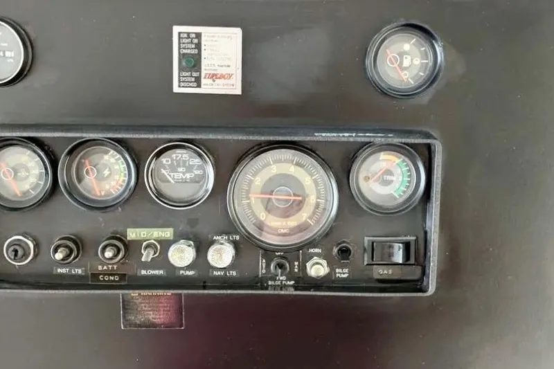 Slide: The Image of Control panel of a 1986 Stardust Cruisers 52 boat with gauges and switches. - 15