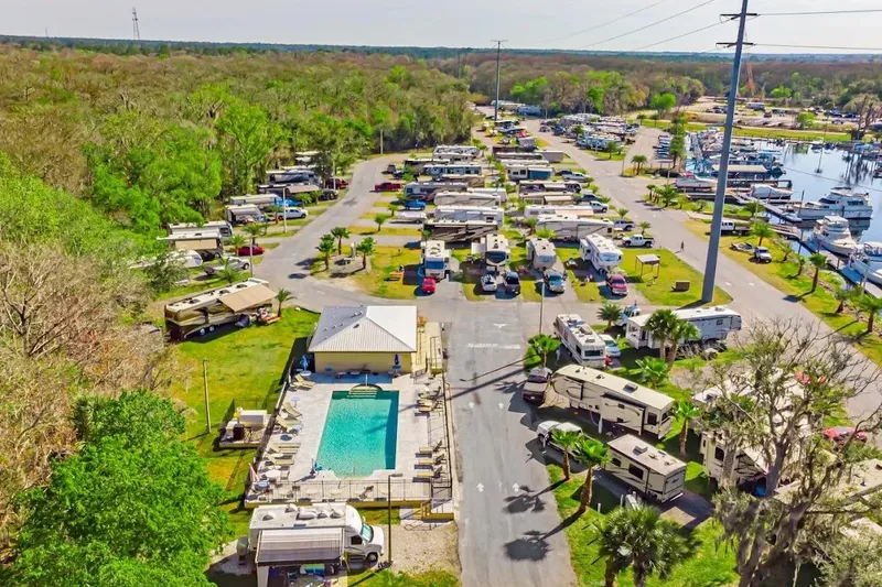 Slide: The Image of Street view with shops, outdoor seating, and parked cars in a vibrant urban area. - 20