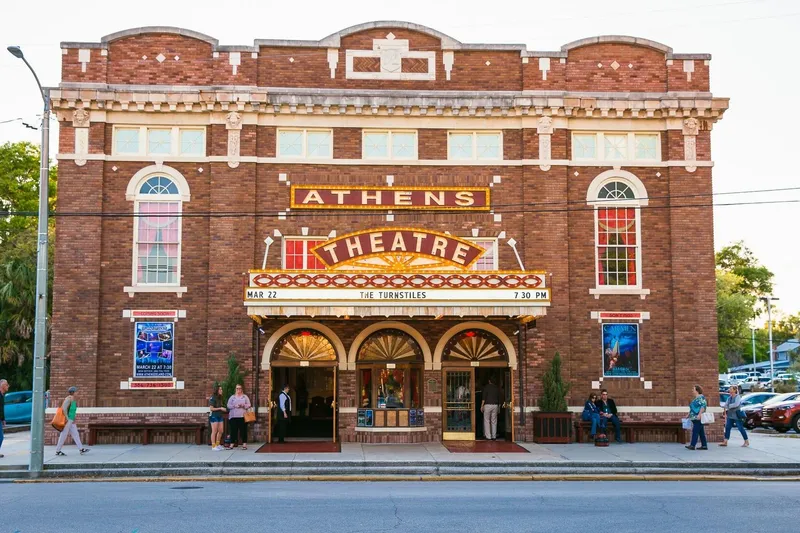 Slide: The Image of Aerial view of a vibrant cityscape with historic architecture and lush greenery under a cloudy sky. - 22