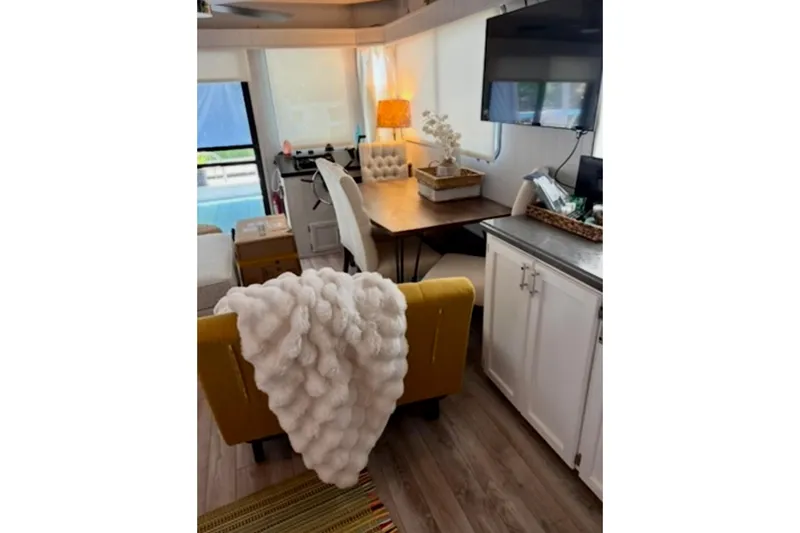Slide: The Image of Cozy kitchen in 1986 Stardust Cruisers 52 houseboat with festive decor and modern appliances. - 5