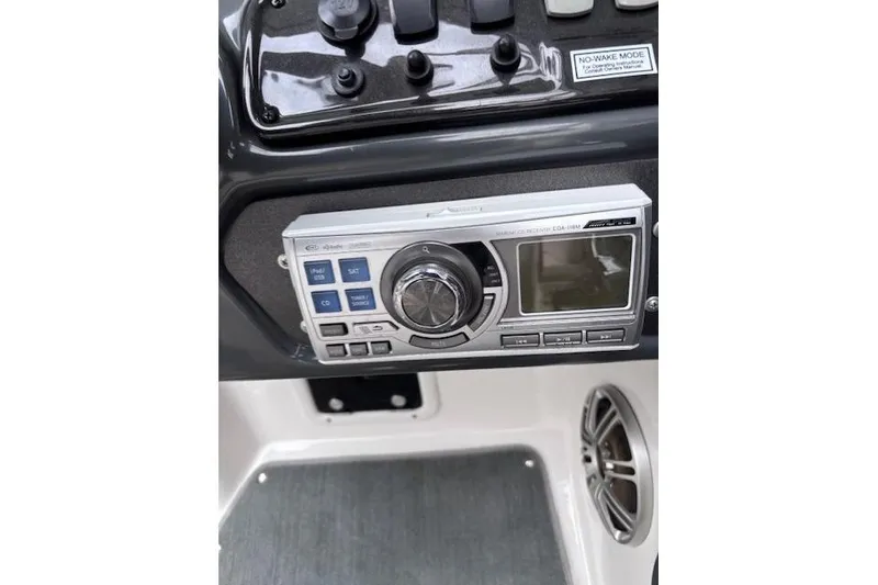 Slide: The Image of 2009 Yamaha Boats AR230 HO dashboard with stereo system and controls. - 14