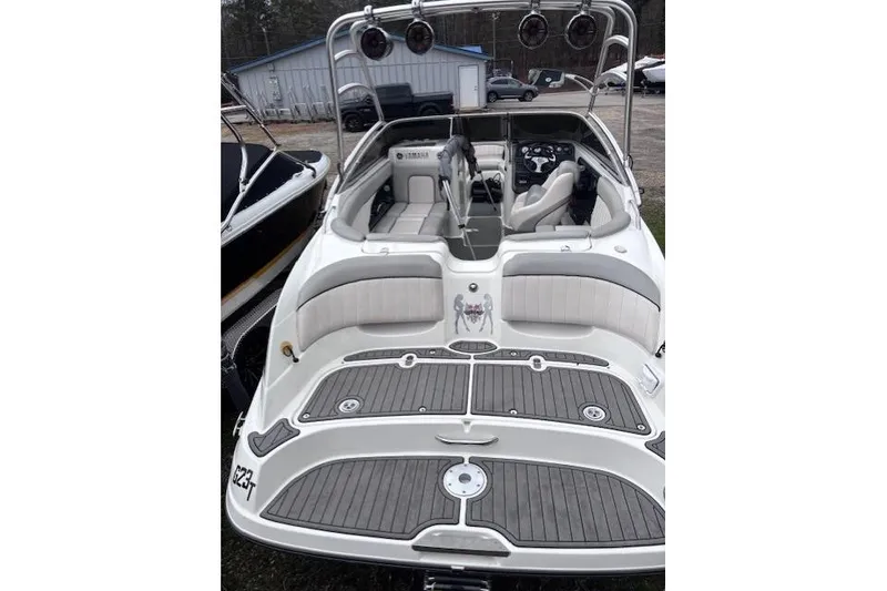 Slide: The Image of 2009 Yamaha Boats AR230 HO, white interior, spacious seating, sleek design, outdoor setting. - 5