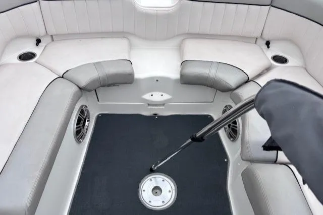 Slide: The Image of 2009 Yamaha Boats AR230 HO interior with cushioned seating and speakers. - 7