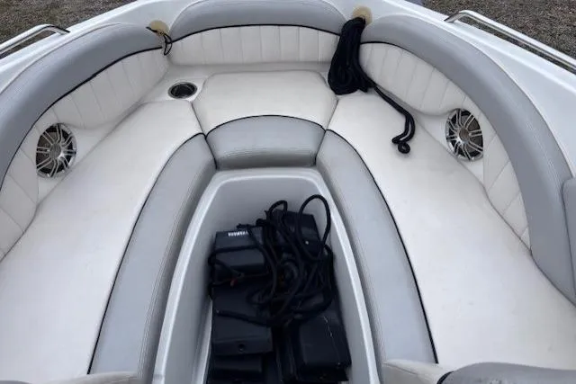 Slide: The Image of 2009 Yamaha Boats AR230 HO interior with white seating and speakers. - 8