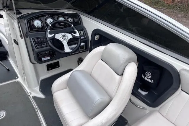 Slide: The Image of 2009 Yamaha Boats AR230 HO cockpit with steering wheel and comfortable seating. - 9