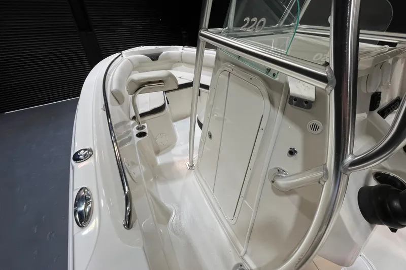Slide: The Image of 2023 Sailfish 220 CC boat interior with sleek design and stainless steel features. - 11