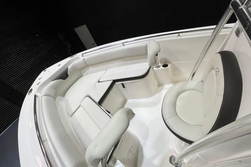 Slide: The Image of 2023 Sailfish 220 CC boat interior with white seating and modern design. - 13