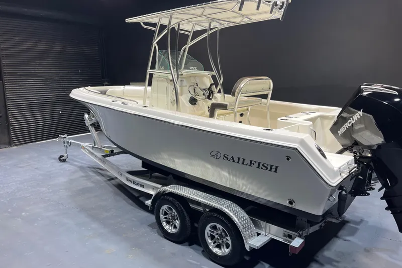 Slide: The Image of 2023 Sailfish 220 CC boat on trailer with Mercury engine in a showroom. - 3