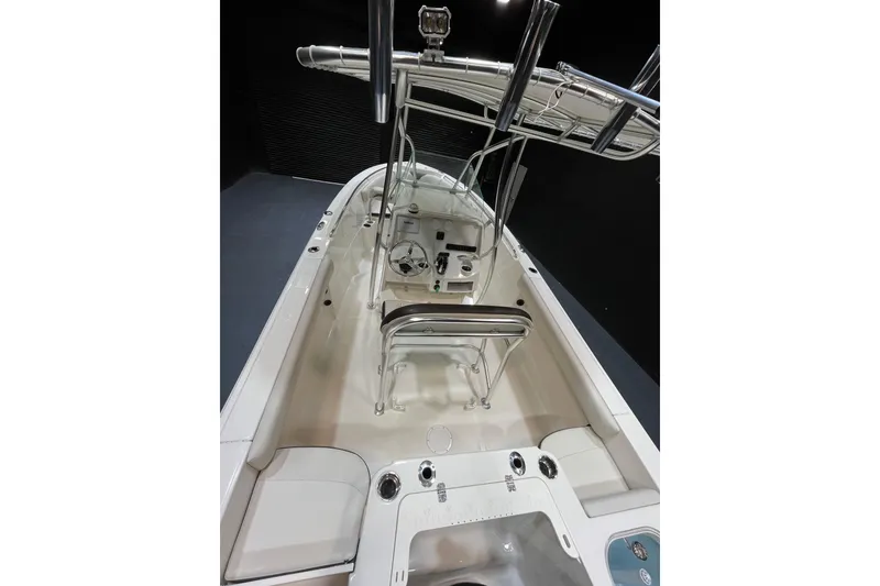 Slide: The Image of 2023 Sailfish 220 CC boat interior with steering console and seating. - 5