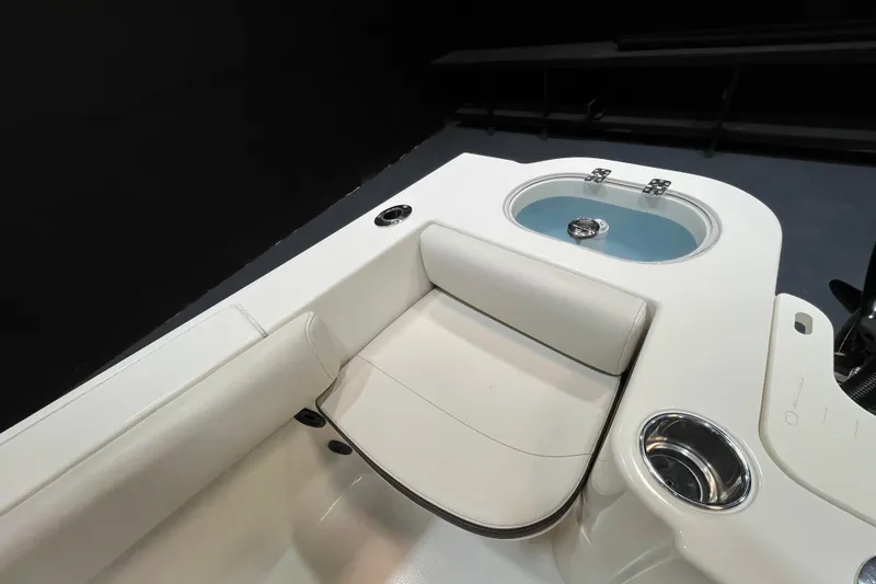Slide: The Image of 2023 Sailfish 220 CC boat interior with seating and cup holder. - 6
