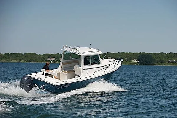 Slide: The Image of 2026 Steiger Craft 21 Miami boat cruising on a lake under clear blue skies. - 3