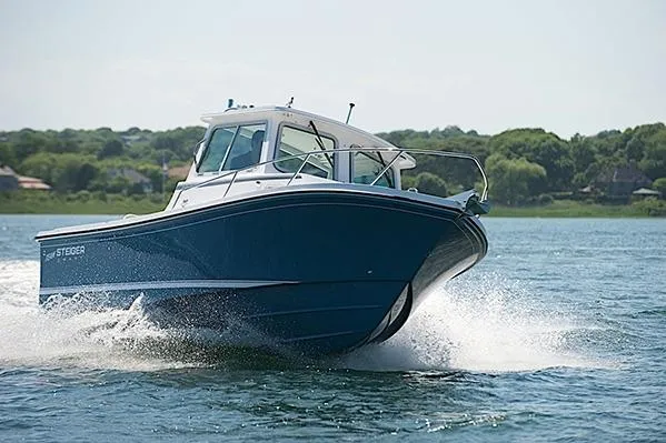 Slide: The Image of 2026 Steiger Craft 21 Miami boat cruising on a scenic lake. - 4