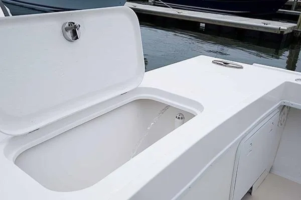 Slide: The Image of Open storage compartment on 2026 Steiger Craft 21 Miami boat, dockside view. - 8