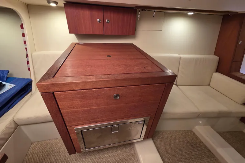 Slide: The Image of Luxurious interior of 2018 Tofinou 12 yacht with wooden cabinetry and beige seating. - 14