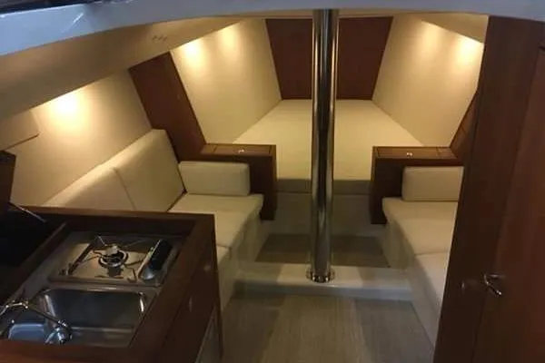 Slide: The Image of Luxurious interior of 2018 Tofinou 12 yacht with cozy seating and kitchenette. - 15