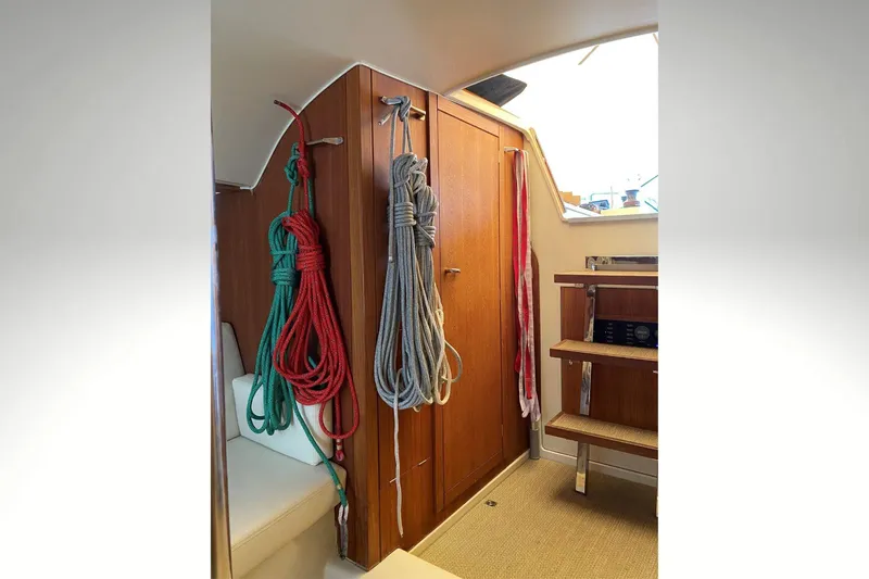 Slide: The Image of Interior of 2018 Tofinou 12 sailboat with ropes and wooden cabinetry. - 23